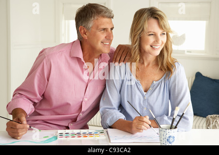 Mid age couple painting with watercolors Stock Photo