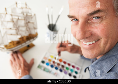 Mid age man model making Stock Photo