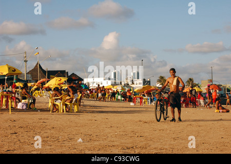 People sitting on the beach at Boa Viagem in Recife Brazil Stock Photo