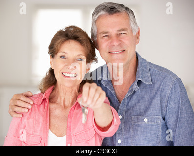 Senior couple moving into new home Stock Photo