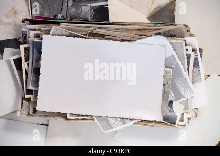 Stack of old photos with one blank photo for your image. Stock Photo