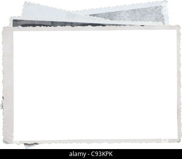 Blank photo frame on a stack of old photos. Clipping path included for eassy issolation Stock Photo