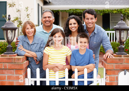 Hispanic family outside home Stock Photo