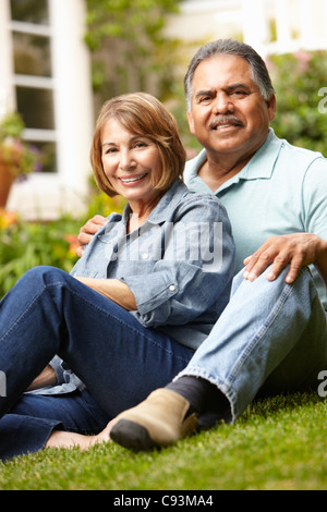 Senior couple relaxing in garden Stock Photo