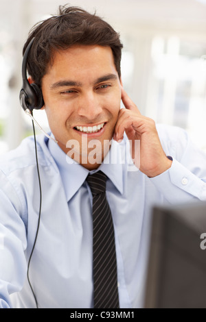 Businessman wearing headset Stock Photo