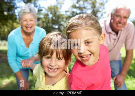 Senior couple in country with grandchildren Stock Photo