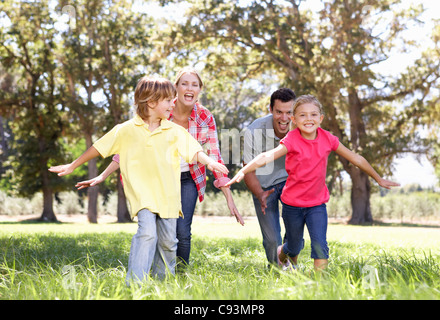 Parents playing with children in country Stock Photo