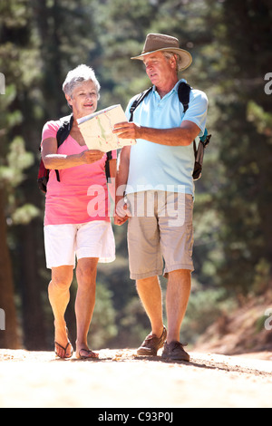 Senior couple reading map on country walk Stock Photo