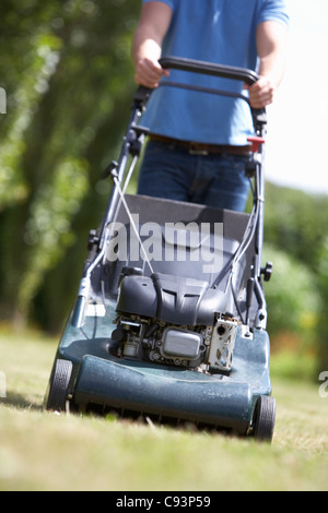 Man mowing lawn Stock Photo