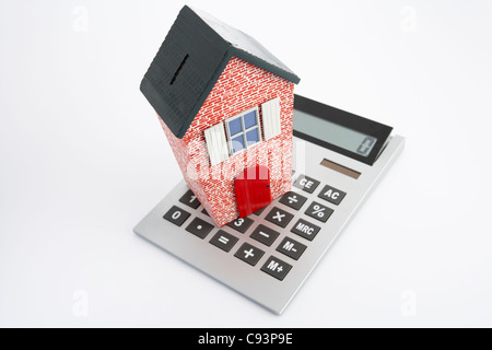 Model house and calculator Stock Photo