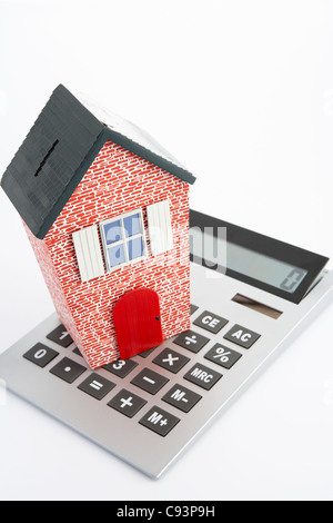 Model house and calculator Stock Photo