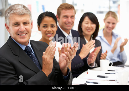 Business people clapping Stock Photo