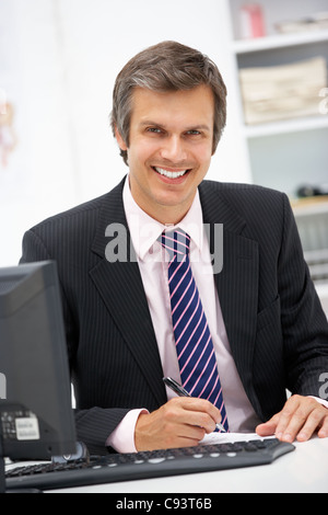 Doctor at desk Stock Photo
