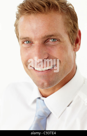 Studio portrait of confident businessman wearing suit and tie and ...