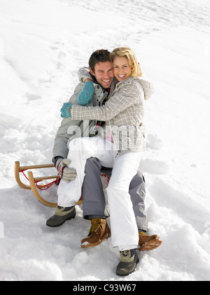 Young Couple On A Sled Stock Photo