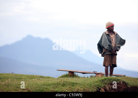 A boy and bench in rural South West Uganda, near the town of Kisoro. 29/1/2009. Photograph: Stuart Boulton/Alamy Stock Photo