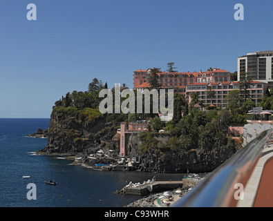 Looking across to Reids Palace Hotel from the Royal Savoy Hotels on the coast coastline Funchal Madeira Portugal EU Europe Stock Photo