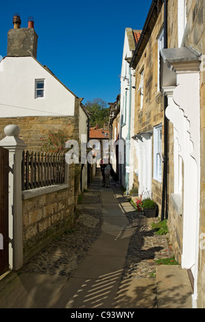 Row of cottages houses homes in summer Robin Hoods Bay North Yorkshire England UK United Kingdom GB Great Britain Stock Photo