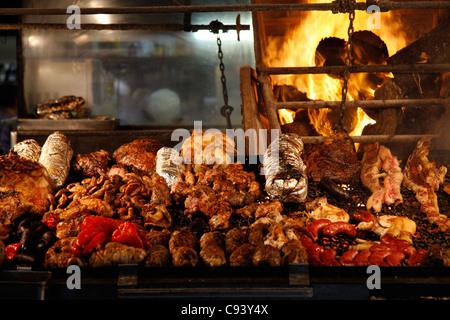 Meats cooked over wood barbecues at the Mercado del Puerto, Montevideo, Uruguay. Stock Photo