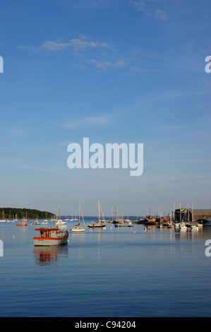 Diminishing perspective view of boats in the Passagassawakeag River, Belfast, Maine. Stock Photo