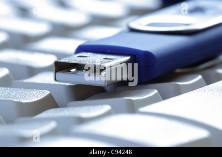 USB flash drive on laptop keyboard Stock Photo
