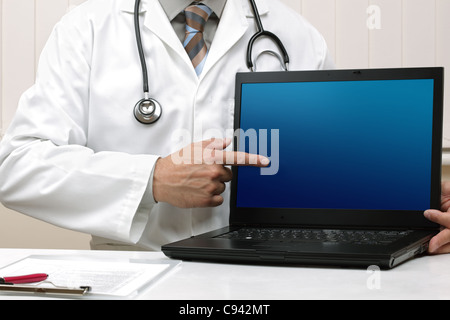 Doctor with blank laptop screen Stock Photo