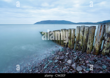 Groyne at the entrance to Porlock Weir Harbour with Bossington Hill in the Distance. Somerset. England. UK. Stock Photo