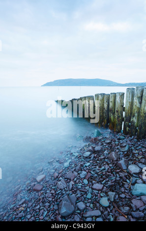 Groyne at the entrance to Porlock Weir Harbour with Bossington Hill in the Distance. Somerset. England. UK. Stock Photo