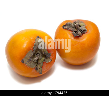 Red juicy persimmons isolated on white background Stock Photo