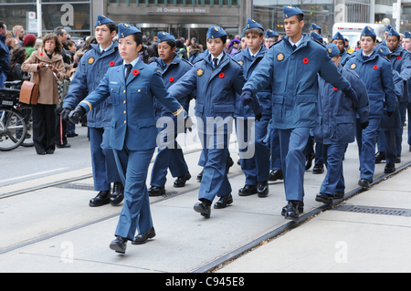 Royal Canadian Air Cadet Paiva leads squad mates marching along Queen Street West in front of Old City Hall during the Remembrance Day ceremony in Toronto, Ontario, Canada, November 11, 2011. Stock Photo