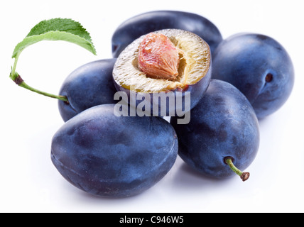 Group of plums with leaf isolated on a white background. Stock Photo