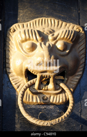 Ancient doorknob with a figure of lion Stock Photo
