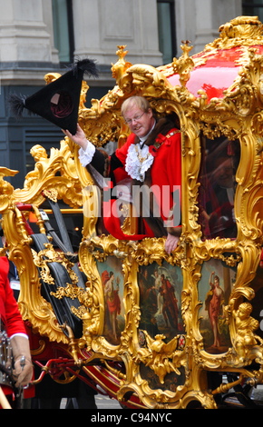 The Lord Mayor in his carriage waves to the crowds outside St Paul's Cathedral The Lord Mayors Show London 2011 Stock Photo