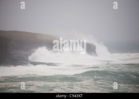 Storm driven waves crashing over 80 foot cliffs at Deerness on Orkney Mainland, Scotland, UK. Stock Photo