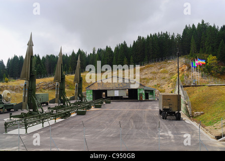 Coe pass, Trentino, Italy. Cold war. Ex NATO base Tuono ( Thunder) . Missiles Nike-Hercules on launch pads and the hangar. Stock Photo
