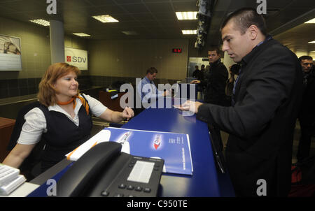 Czech soccer player Milan Baros, right, is seen at Prague's airport Ruzyne before he leaves Prague to Montenegro for EURO 2012 qualification match, Czech Republic, on Sunday, November 13, 2011. (CTK Photo/Vit Simanek) Stock Photo
