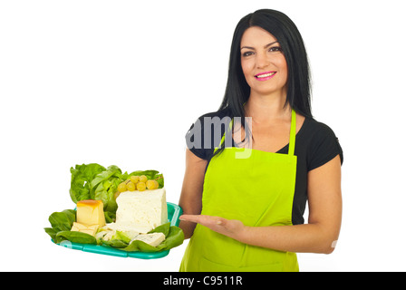 Happy cheesemaker woman showing different cheese on plateau isolated on white background Stock Photo