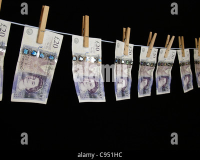 £20 notes peg on a washing line, UK Stock Photo