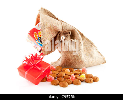 Typical Dutch celebration: Sinterklaas with bag and ginger nuts, ready for the kids in december. Isolated on white background Stock Photo