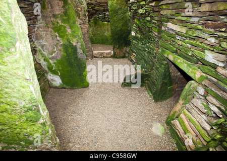 Unstan Chambered Cairn is a stone age burial mound near Stenness on Orkney's Mainland. Stock Photo