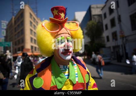 A clown walks in a parade during the International Clown Convention organized by the Latino Clown Brotherhood in Mexico City Stock Photo