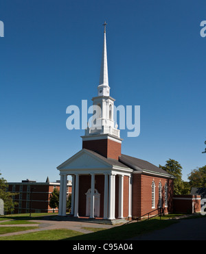 Manning Memorial Chapel on the Acadia University Campus. A new-england style chapel's steeple is topped by a 6 foot cross