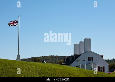 Blockhouse and British Flag at Fort Saint Anne. Now a museum set in the immaculately trimmed earthwork fortifications. Stock Photo