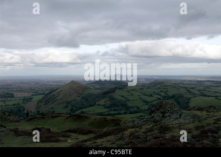 The Shropshire Hills offer a lone hiker an absolutely wonderful vista,viewed from the summit of Caer Caradoc. Stock Photo