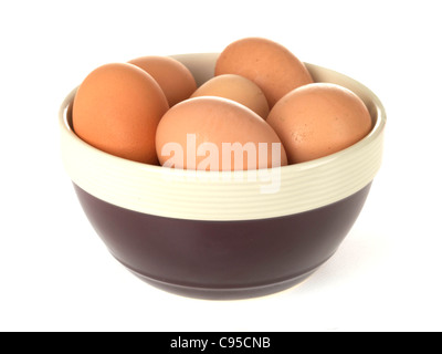 Kitchen Bowl With A Selection Of Brown Uncooked Hens Eggs Isolated Against A White Background With No People Stock Photo