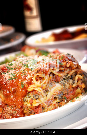 Plate of lasagna at an Italian restaurant Stock Photo