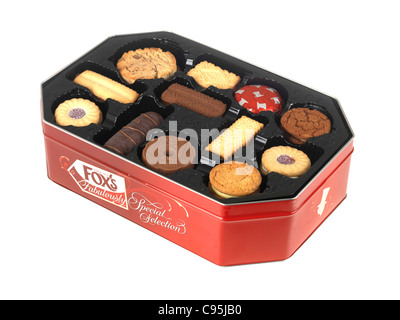 Red Tin Of Branded Fox's Biscuits Selection Isolated Against A White Background With A Clipping Path And No People Stock Photo