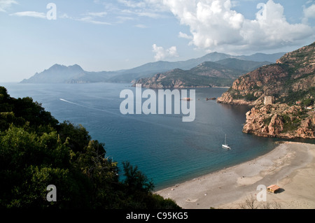 A view of the beach and Genoan fort in the town of Porto, on the Gulf of Porto, on the west coast of the island of Corsica, France. Stock Photo