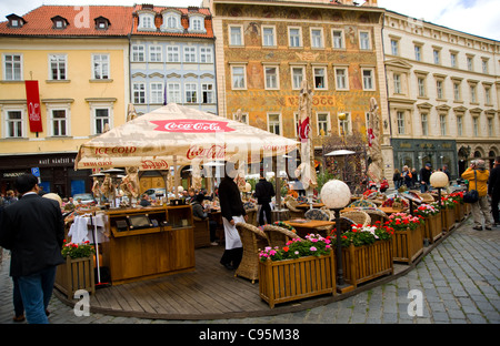open air outdoor seating restaurant people eating resting enjoying drinking beer Prague Rocc square Stock Photo
