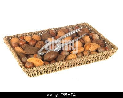 Wicker Basket Or Tray Of Whole Mixed Healthy Nuts With Their Shells On Against A White Background With A Clipping Path And No People Stock Photo